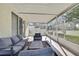 Beautiful screened patio with comfortable seating, perfect for relaxing and enjoying the outdoors at 7740 Blue Spring Dr, Land O Lakes, FL 34637