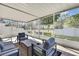 Inviting screened patio with comfortable furniture and serene views of the garden at 7740 Blue Spring Dr, Land O Lakes, FL 34637