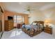 Cozy bedroom featuring patterned bedding, wood furniture, and natural light at 9910 Eagles Point Cir # 3, Port Richey, FL 34668