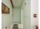 Light and airy hallway with neutral walls and tiled flooring at 9910 Eagles Point Cir # 3, Port Richey, FL 34668