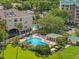 Aerial view of the community pool and surrounding buildings with manicured landscaping at 1002 S Harbour Island Blvd # 1312, Tampa, FL 33602