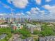 Scenic aerial view featuring city skyline, green trees, and buildings with green rooftops at 1002 S Harbour Island Blvd # 1312, Tampa, FL 33602