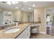 Bathroom featuring double vanity with granite countertop and large, bright mirror at 1002 S Harbour Island Blvd # 1312, Tampa, FL 33602
