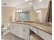 Bathroom featuring double sink granite vanity and walk-in tiled shower at 1002 S Harbour Island Blvd # 1312, Tampa, FL 33602