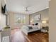 Cozy bedroom featuring a ceiling fan, modern lamps, and ample natural light at 1002 S Harbour Island Blvd # 1312, Tampa, FL 33602