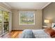 Bedroom featuring hardwood floors, a large window, and a view of the city at 1002 S Harbour Island Blvd # 1312, Tampa, FL 33602