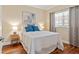 Well-lit bedroom showcasing wood floors, large window and stylish contemporary decor at 1002 S Harbour Island Blvd # 1312, Tampa, FL 33602