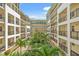 Courtyard featuring lush tropical landscaping, walkways, and balconies overlooking the gardens at 1002 S Harbour Island Blvd # 1312, Tampa, FL 33602