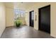 Well-lit elevator lobby area with sleek doors and a view of the city skyline through a large window at 1002 S Harbour Island Blvd # 1312, Tampa, FL 33602