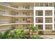 Exterior building shot showcasing unit 1312 and elevator access points with lush greenery at 1002 S Harbour Island Blvd # 1312, Tampa, FL 33602