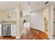 Hallway showing stainless steel dishwasher, wood flooring and view into other living spaces at 1002 S Harbour Island Blvd # 1312, Tampa, FL 33602