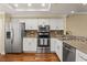 Modern kitchen with stainless steel appliances, granite countertops, and white cabinets at 1002 S Harbour Island Blvd # 1312, Tampa, FL 33602