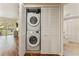 Stacked white washer and dryer inside folding closet doors, located near bathroom at 1002 S Harbour Island Blvd # 1312, Tampa, FL 33602