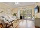 Bright living room featuring modern furniture, wood floors, and sliding glass doors to the balcony at 1002 S Harbour Island Blvd # 1312, Tampa, FL 33602