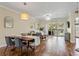 Open-concept space showcasing living and dining areas with hardwood floors and balcony access at 1002 S Harbour Island Blvd # 1312, Tampa, FL 33602