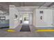 Bright parking garage featuring a fire extinguisher, and an automatic doorway to the interior of the building at 1002 S Harbour Island Blvd # 1312, Tampa, FL 33602