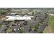 Aerial shot of the facility featuring a large parking lot and well-maintained grounds at 1012 Warwick Ct, Sun City Center, FL 33573