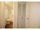 This bathroom features a shower and bathtub combination, along with tile walls and wood look flooring at 1012 Warwick Ct, Sun City Center, FL 33573