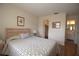 This bedroom offers laminate floors and a walk-in closet, with an adjacent bathroom at 1012 Warwick Ct, Sun City Center, FL 33573