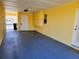 An enclosed carport providing covered parking, storage, and direct access to the main residence at 1012 Warwick Ct, Sun City Center, FL 33573