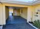 Carport offers covered parking and convenient access to the home at 1012 Warwick Ct, Sun City Center, FL 33573