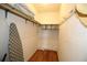 Walk-in closet with ample storage space, hanging racks, and shelving for organized living at 1012 Warwick Ct, Sun City Center, FL 33573