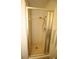 Bathroom shower featuring a sliding door and yellow and white tiled flooring at 1012 Warwick Ct, Sun City Center, FL 33573