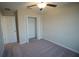 Bedroom features carpeted floors, closet, and ceiling fan at 1038 Ocean Spray Dr, Ruskin, FL 33570