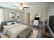 Cozy bedroom featuring a comfortable bed, modern decor, and a functional workspace at 1038 Ocean Spray Dr, Ruskin, FL 33570