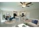 Open-concept living space featuring a modern kitchen, dining area, and comfortable seating at 1038 Ocean Spray Dr, Ruskin, FL 33570