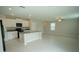 Spacious open-concept living area with modern kitchen and ample natural light at 1038 Ocean Spray Dr, Ruskin, FL 33570