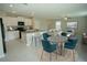 Bright and open living space with a kitchen island, dining area, and comfortable seating arrangement at 1038 Ocean Spray Dr, Ruskin, FL 33570