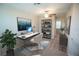 Well-lit home office space with a sleek desk, shelving, and modern decor at 1038 Ocean Spray Dr, Ruskin, FL 33570