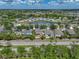 An aerial view shows a home in a lakeside community, near scenic views and a well-connected road system at 11308 Callaway Pond Dr, Riverview, FL 33579
