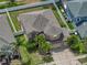 Aerial view of home showing mature landscaping, driveway, and neighborhood at 11308 Callaway Pond Dr, Riverview, FL 33579