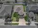 Aerial view of the home featuring a well maintained yard and mature landscaping at 11308 Callaway Pond Dr, Riverview, FL 33579