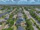 Aerial view of a beautiful home in a lakeside community, with lush landscaping, a nearby neighborhood pool and easy road access at 11308 Callaway Pond Dr, Riverview, FL 33579