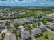 Aerial view of home in a tranquil neighborhood with lush landscaping at 11308 Callaway Pond Dr, Riverview, FL 33579