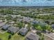 Aerial view of a beautiful home in a lakeside community, lush landscaping, and easy access to main roads at 11308 Callaway Pond Dr, Riverview, FL 33579