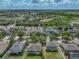 Aerial view of home in a tranquil neighborhood, surrounded by lush landscaping at 11308 Callaway Pond Dr, Riverview, FL 33579