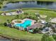 A scenic view of the community pool featuring a playground, gazebo, and a picnic area for a fun recreational space at 11308 Callaway Pond Dr, Riverview, FL 33579