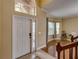 Welcoming foyer with high ceilings, tile floor, and staircase at 11308 Callaway Pond Dr, Riverview, FL 33579