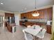 Spacious kitchen features a center island, stainless steel appliances, and granite countertops at 11308 Callaway Pond Dr, Riverview, FL 33579