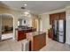 Open kitchen layout featuring granite countertops, stainless steel appliances, and modern lighting at 11308 Callaway Pond Dr, Riverview, FL 33579