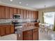 Bright eat-in kitchen with stainless steel appliances and large window at 11308 Callaway Pond Dr, Riverview, FL 33579