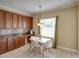 Bright eat-in kitchen featuring modern table set and stainless steel appliances at 11308 Callaway Pond Dr, Riverview, FL 33579