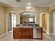 Open kitchen with stainless steel appliances, granite countertops, and tile floors at 11308 Callaway Pond Dr, Riverview, FL 33579