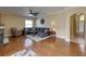 Cozy living room with hardwood flooring, stylish decor, and a comfortable gray sectional sofa at 11308 Callaway Pond Dr, Riverview, FL 33579
