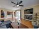 Open layout with stone fireplace, kitchen view, and sliding doors offering abundant natural light at 11308 Callaway Pond Dr, Riverview, FL 33579