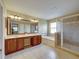 Large bathroom with double sinks, a soaking tub, and a glass shower at 11308 Callaway Pond Dr, Riverview, FL 33579